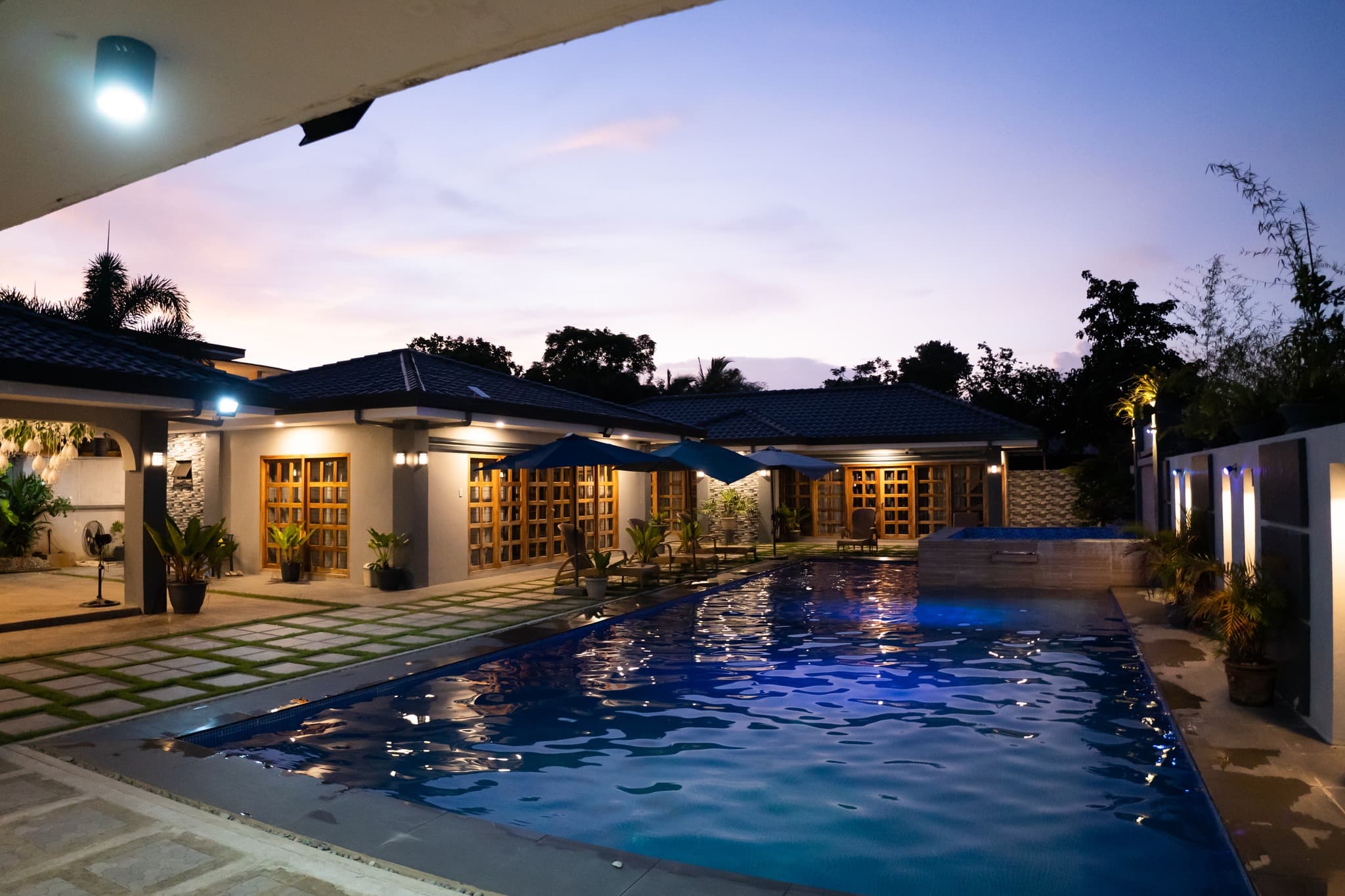 Casa Venice Resort pool at twilight with ambient blue LED lighting